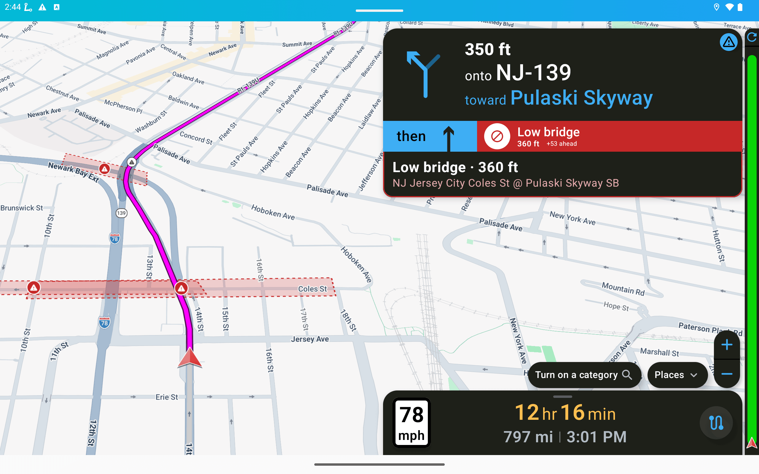 On the tablet: next maneuver at the top (350 ft onto NJ-139 toward Pulaski Skyway), the low bridge alert with its distance and the restricted segments marked on the map, your route, speed, remaining time and miles.